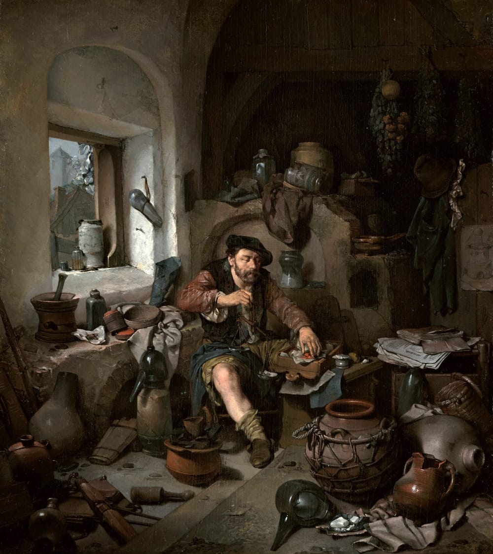 17th-century Dutch painting of an alchemist in his workshop, surrounded by glass vessels, ceramic jugs, papers, and scientific instruments in a cluttered stone-walled room with arched doorway